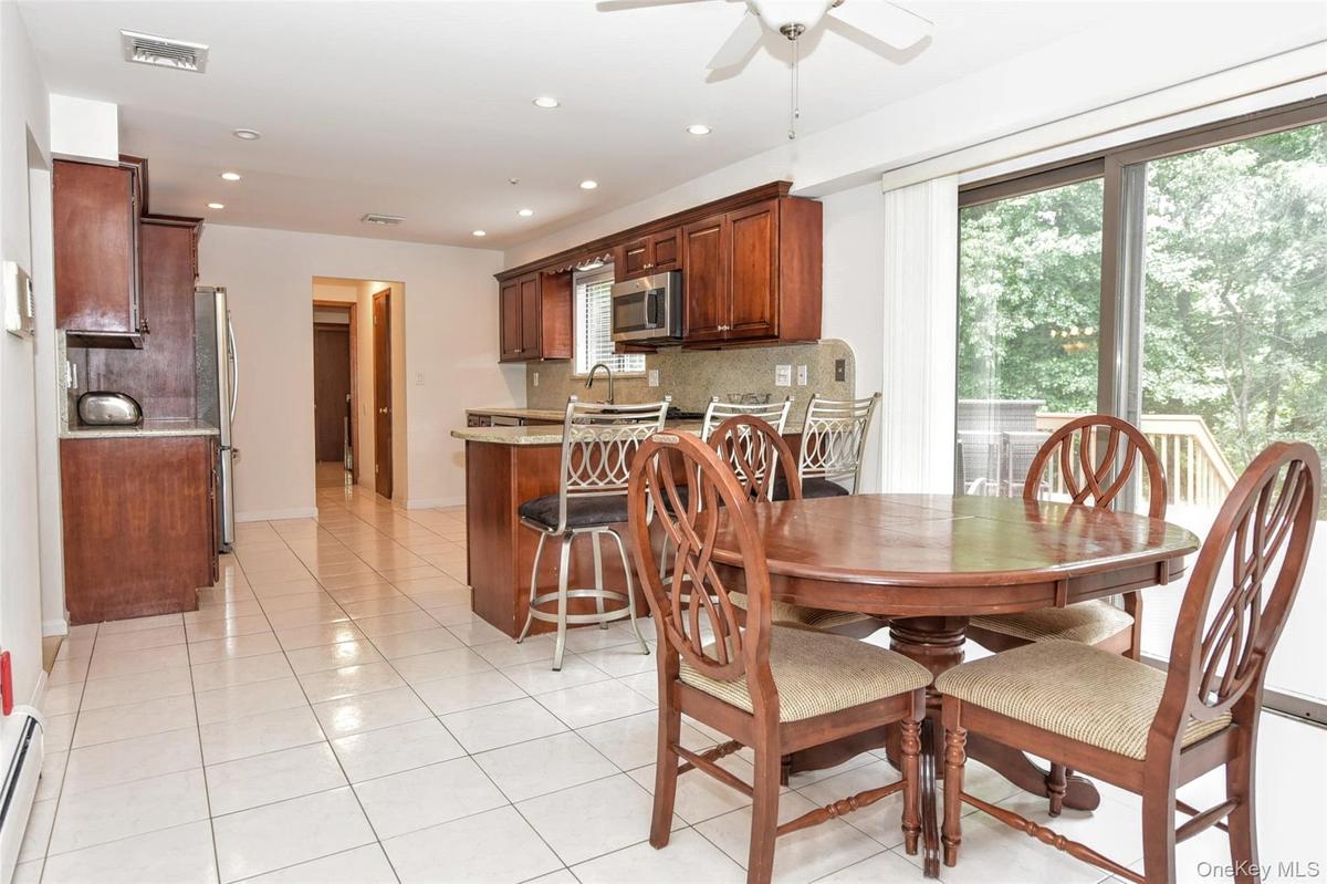Spacious Eat-in kitchen with sliders to deck