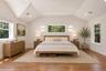 Primary Bedroom Suite with high ceilings, WIC and hardwood floors. 3 exposures