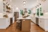 Open Kitchen with walk in pantry and stainless steel appliances