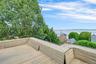 deck with unobstructed river and bridge views