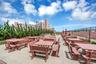 OUTDOOR DINING...Equipd with multiple grills, tables and chairs ideal for mingling, grilling, flanking the ocean