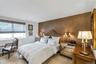 Spacious Bedroom en-suite with Custom Wall In California Closets