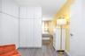 Bedroom with light wood finished floors and baseboards