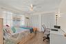Comfortable and spacious third bedroom featuring ample natural light, generous closet space, and flexibility to accommodate family, guests, or a home 