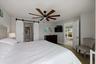 Barn doors leading to primary bathroom and closet
