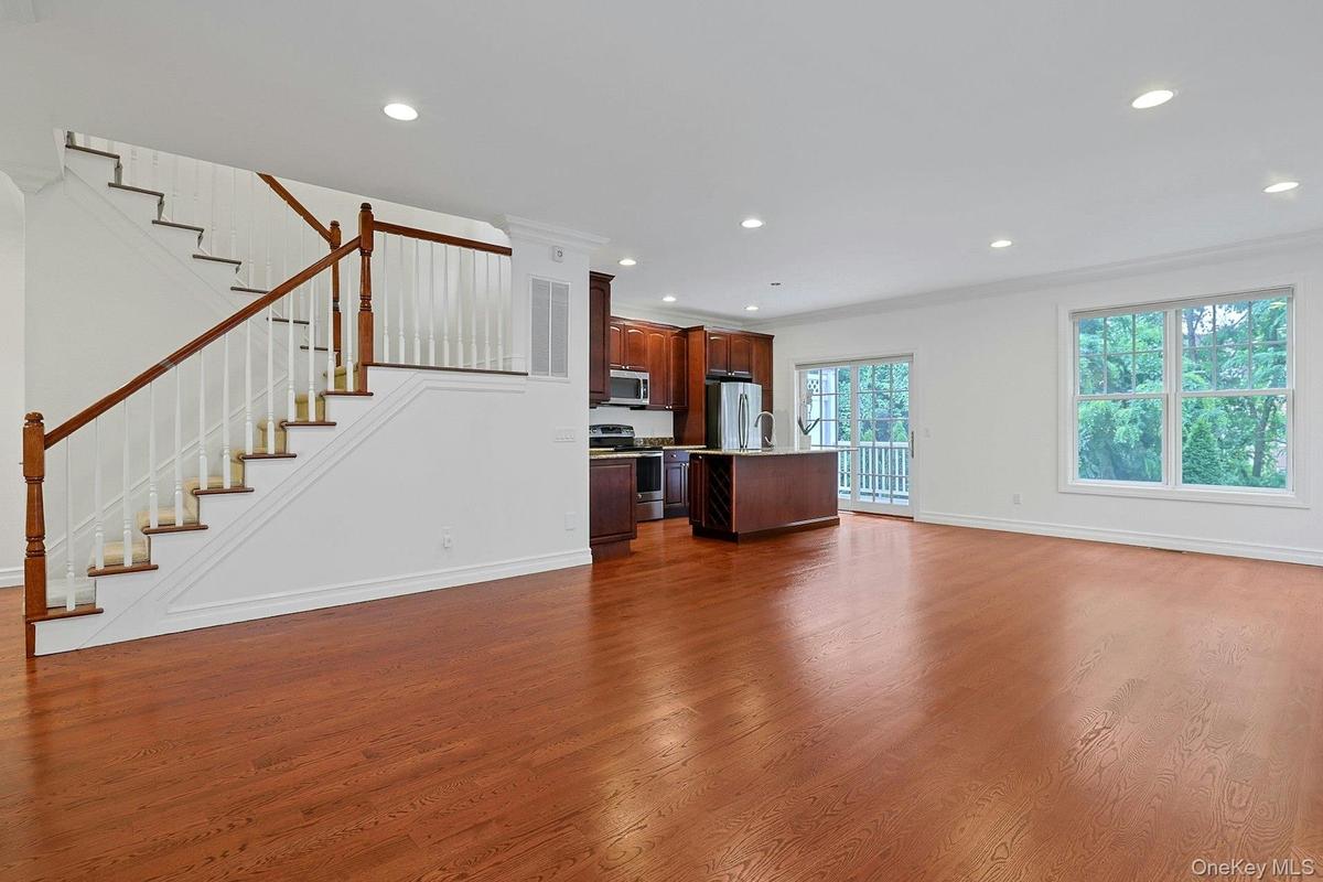 This is the same photo without the digital staging and you can see the generous proportions of the room.