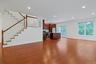 This is the same photo without the digital staging and you can see the generous proportions of the room.