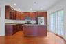 Abundant cabinetry, generous counter space, and a functional layout make meal preparation both efficient and enjoyable.