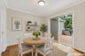 Dining area and kitchen. Slider to Trex Deck overlooking wooded area .