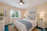 Second bedroom, carpeted, large closet and ceiling fan