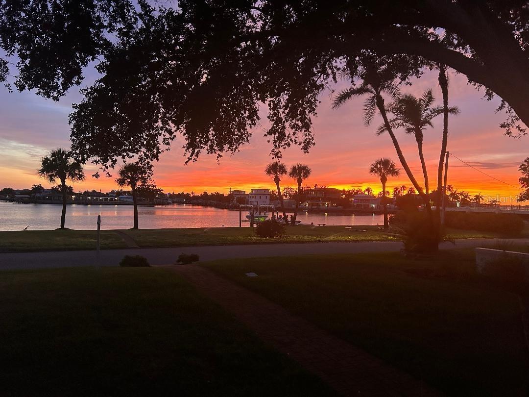 Sunset on the water from the front porch  at 110 Sunset Dr S!!