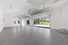 Oversized 3-car garage with industrial-grade epoxy flooring, Wi-Fi garage door openers, and impressive 11-foot ceilings.