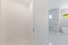 The luxurious primary suite offers a spa-inspired retreat featuring a freestanding soaking tub, oversized walk-in shower with rain head and handheld s