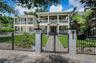 Wrought Iron fence surrounding the front lawn.