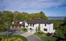 Magnificently set on 1.5 acres surrounded by lush lawns and beautiful perennial landscaping.