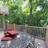 Expansive deck with wood-finish flooring and a full railing system
