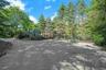 A spacious front guest parking court welcomes visitors with ease and accommodates gatherings large and small.