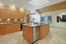 Thoughtfully planned for both everyday living and entertaining, the kitchen offers generous workspace, exceptional storage, and timeless finishes.