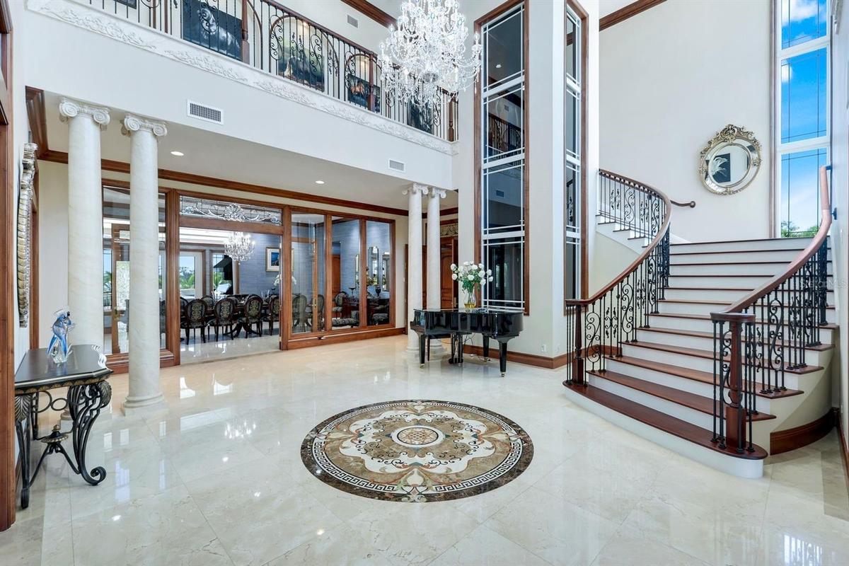 Foyer with glass elevator and staircase