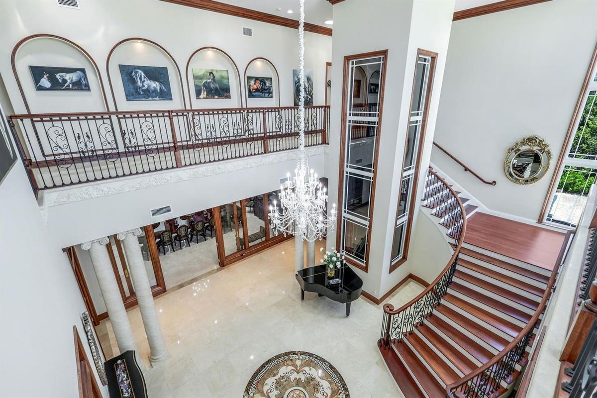 elegant staircase and glass elevator