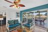 Family room with sliding glass doors opening to large outdoor deck