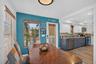 Dining space adjacent to the kitchen (front door visible)