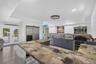 pdated kitchen featuring epoxy countertops, stainless steel appliances, and ample cabinetry.
