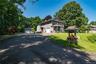 1.57 acres, attached & detached garage. Secluded