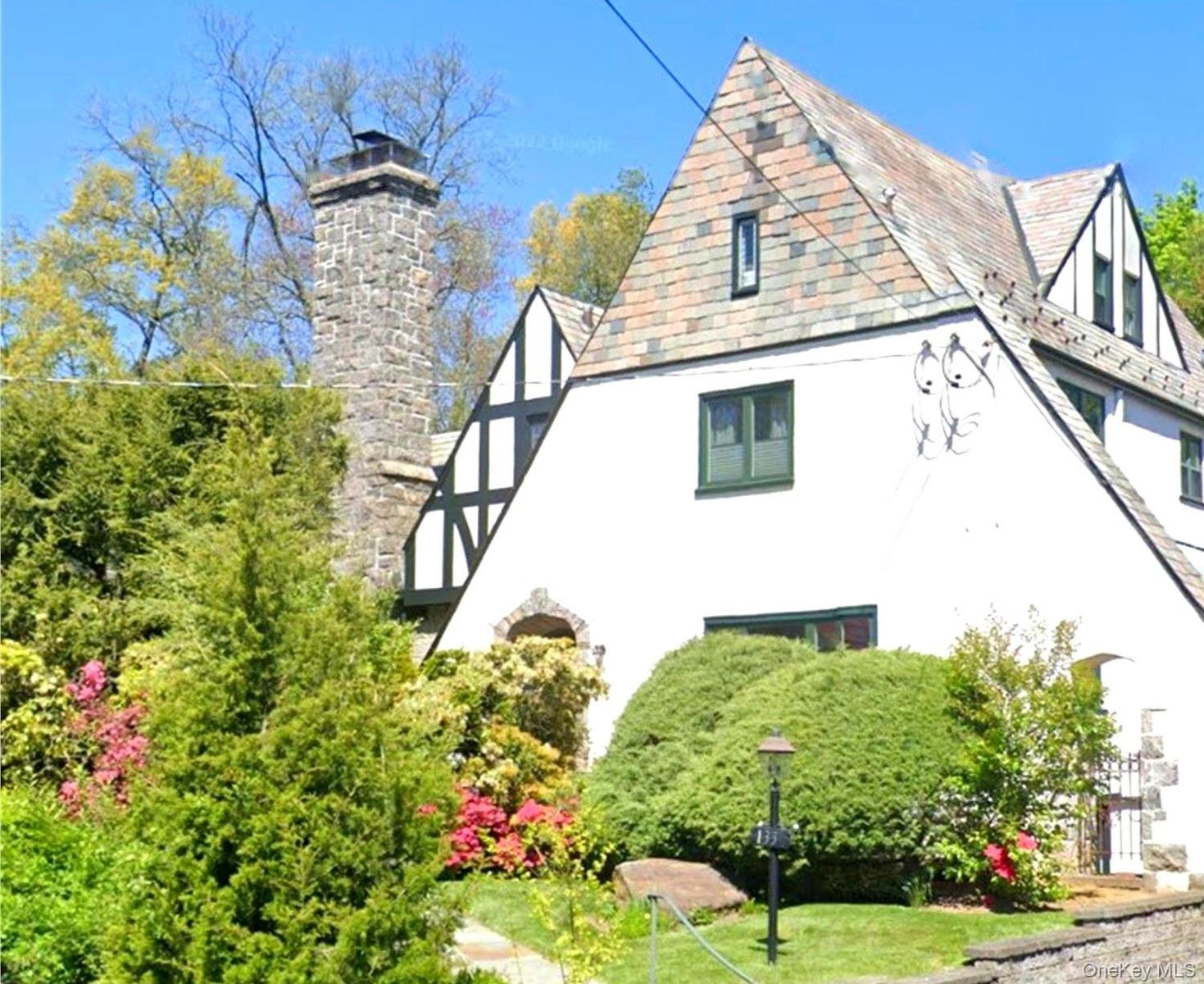 Offered for the first time in over 20 years, 133 Bon Air Avenue is a timeless Tudor distinguished by its iconic stone chimney, classic architecture, a