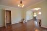Dining Room featuring a solid wood door, hardwood flooring, and crown molding