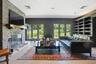 Media room with patio access and built in shelving