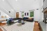 Living area with vaulted ceiling and recessed lighting