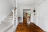 Back to the entry foyer with the front staircase to the bedroom level.