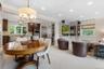 The Breakfast area is open to the Family Room with custom built-in entertainment and storage units.