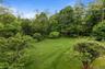 The 1.5+ acres is large enough to provide ample play and entertaining areas, and is also surrounded by mature trees for privacy.