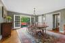 The Formal Dining Room with double French doors opens to the large rear Trex Deck.
