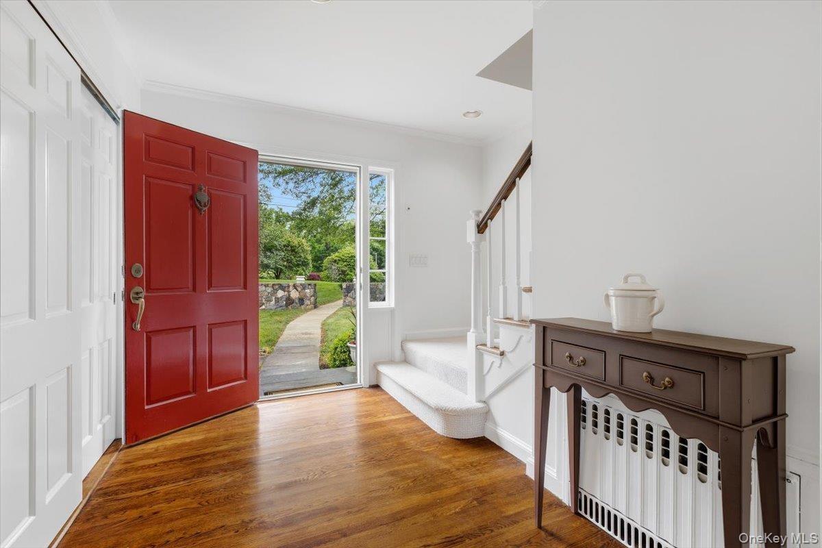 Let's step inside the entrance foyer with a double coat closet. Six panel colonial doors throughout the home.