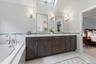 The Primary Bathroom double sink vanity & double medicine chest.