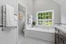 Luxuriate in the soaking tub, followed by heated towels. There’s also a separate toilet closet in the Primary Bathroom.