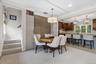 Close up of the Breakfast eating area with access to the back staircase to the second floor.
