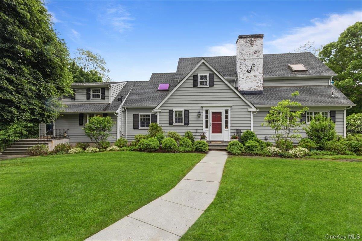 Welcome home to 107 Tower Hill Road, Briarcliff Manor set on 1.5+ acres adjoining Sleepy Hollow CC Golf Course.