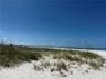 Looking over the dunes to the Gulf. See beach umbrellas in the distance.