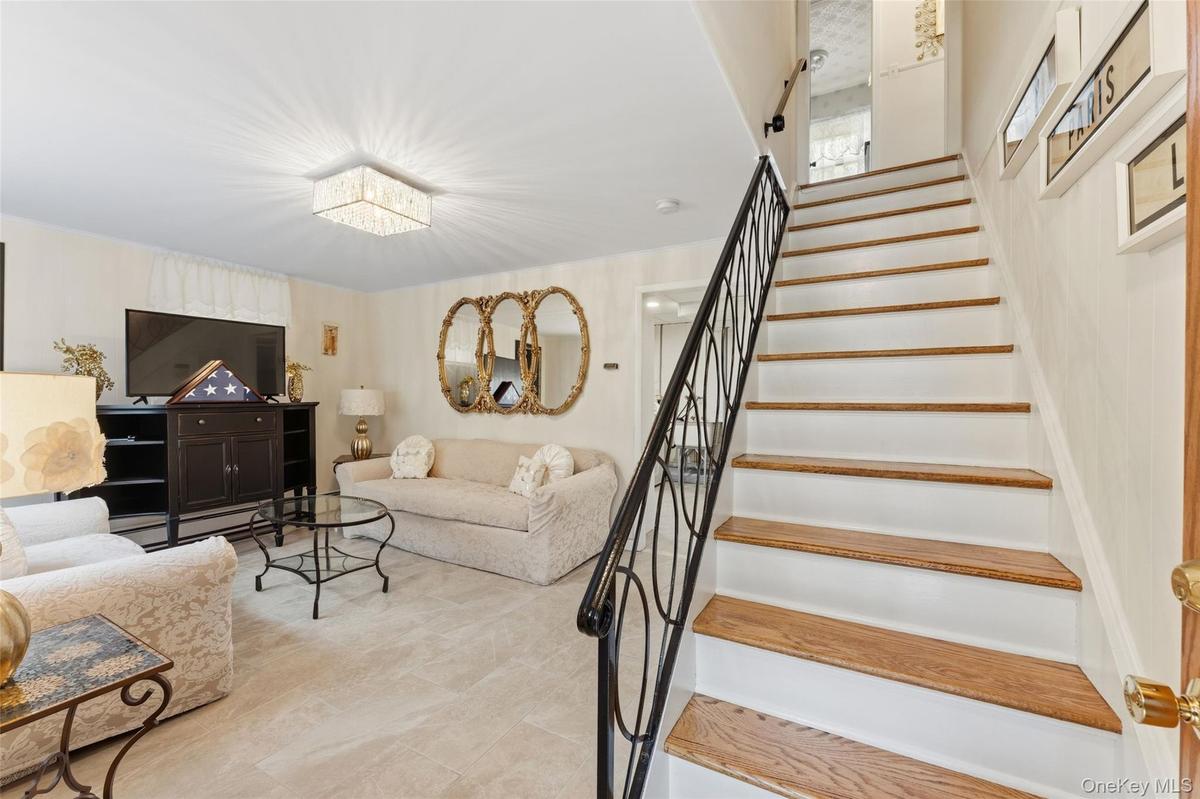 Entrance into the recreation area with access to the laundry, storage and access to the one car garge.