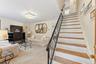 Entrance into the recreation area with access to the laundry, storage and access to the one car garge.