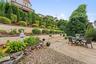 View of the mature perennial plantings and trees.