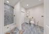 Full Bath 2 with Laundry Closet and Exterior Door for Convenience