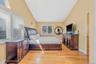 Bedroom featuring lofted ceiling and light wood-type flooring
