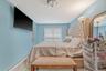 Bedroom with a baseboard heating unit and baseboards