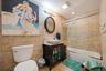Bathroom with tile walls, shower / bath combination with glass door, vanity, tile patterned floors, and recessed lighting