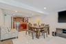 Dining area with recessed lighting and light tile patterned floors